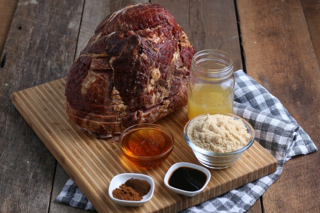 Ingredients used to make Smoked Ham, displayed on cutting board