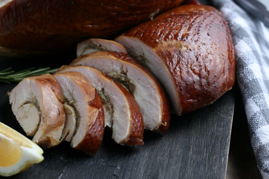 Sliced turkey on serving board