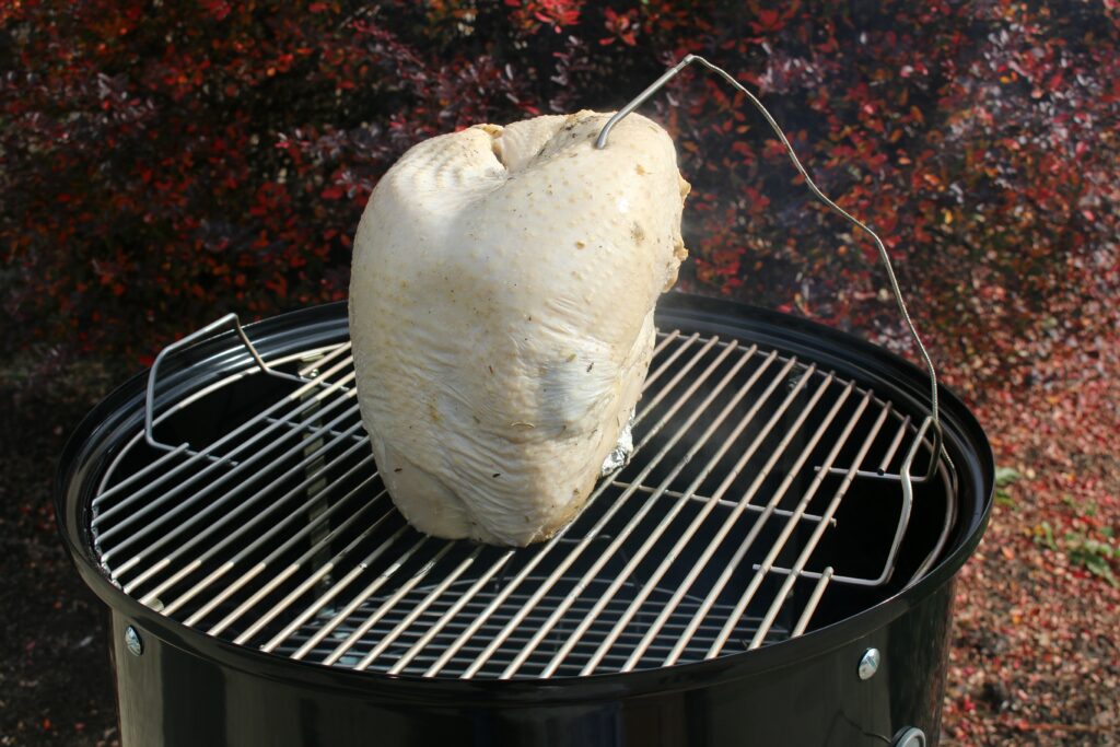 raw turkey on Weber Smoker