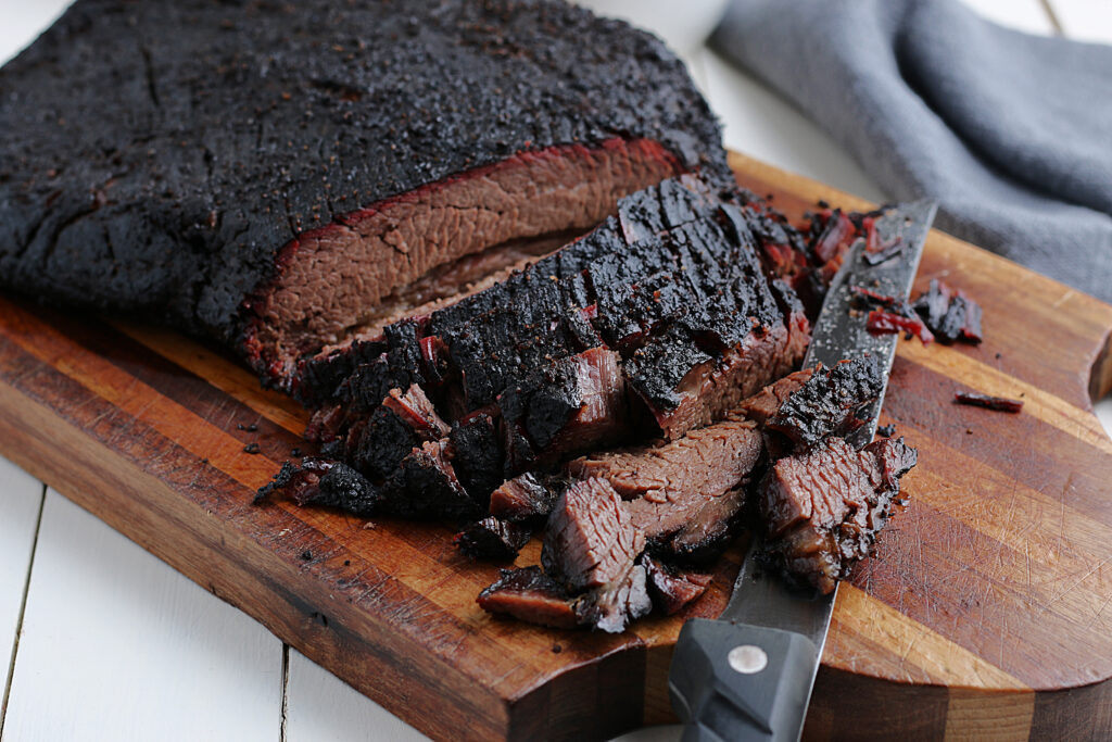 smoked brisket served on cutting board