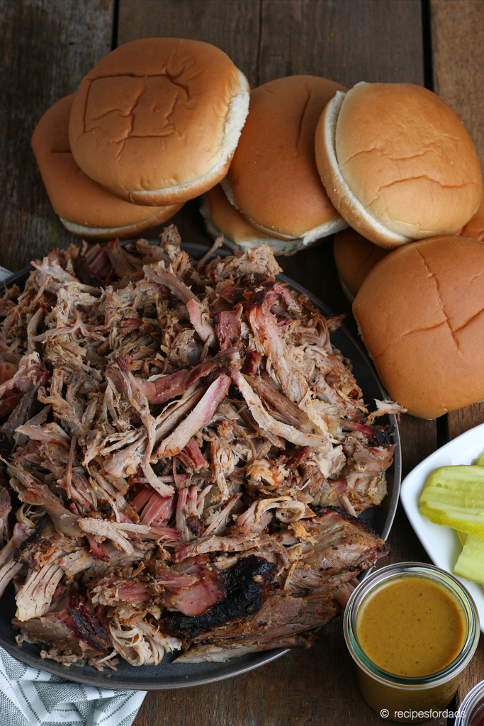 cooked smoked pork butt shredded and served with hamburger buns