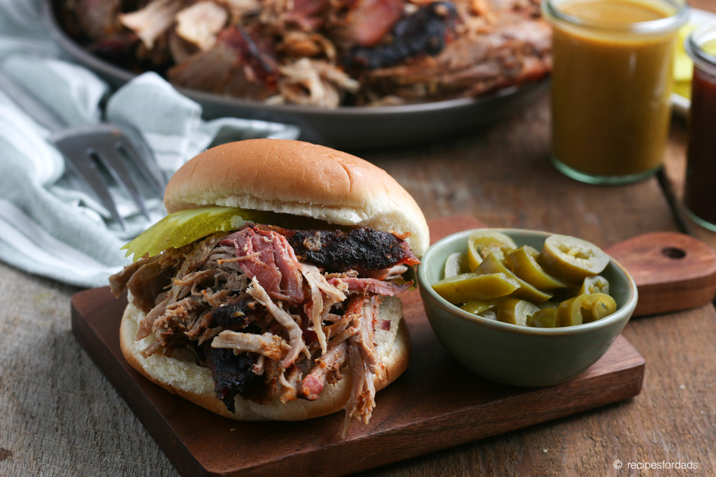 Smoked Pork Butt servedon hamburger bun with jalepenos