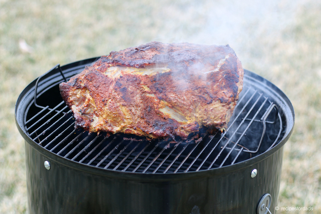 Smoked Pork Shoulder cooking on a Weber Smoker