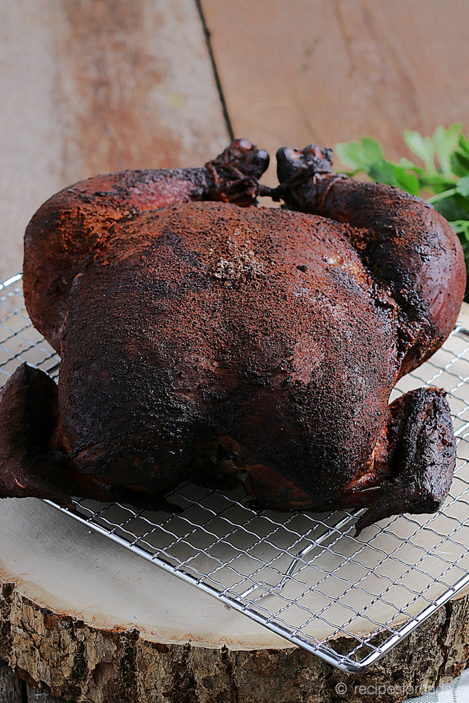 whole Smoked Chicken served over wood log and wired serving tray