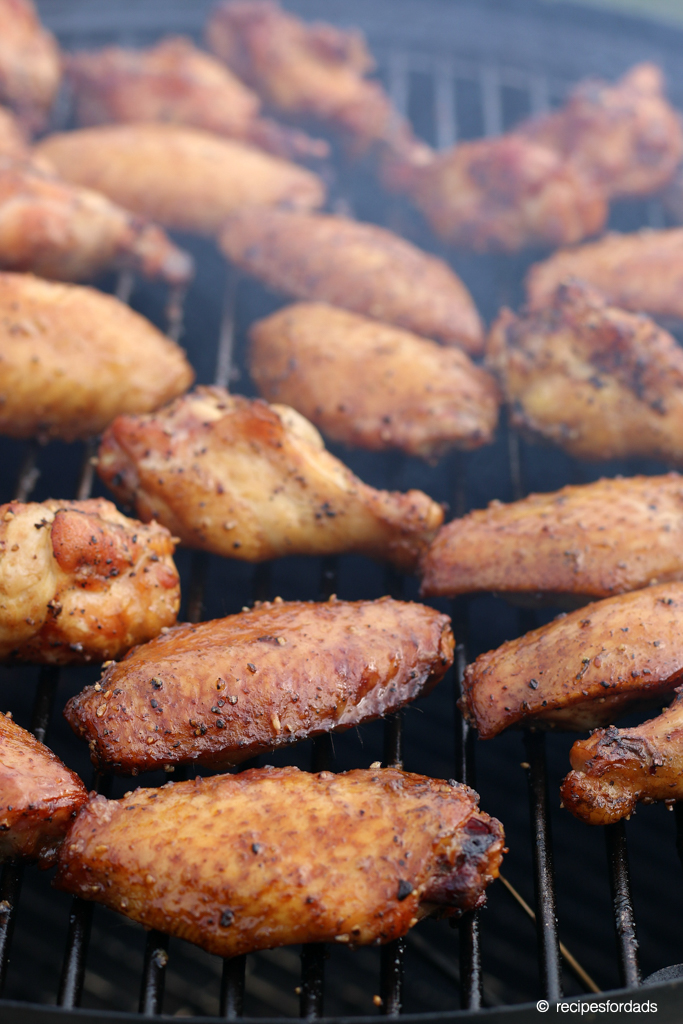 Smoked wings cooking on Weber smoker