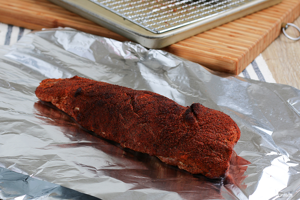 Smoked Pork Tenderloin seasoned and ready to be wrapped in foil