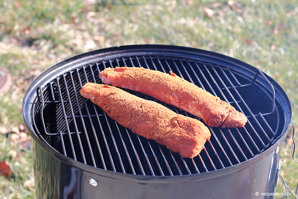 smoked pork tenderloin smoking on a Weber smoker 