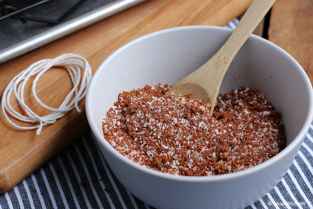 poultry rub for smoked whole chicken served in white bowl