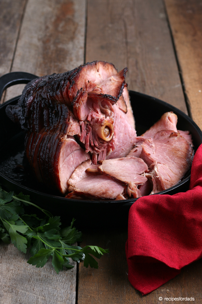 Smoked ham served in iron skillet with red napkin