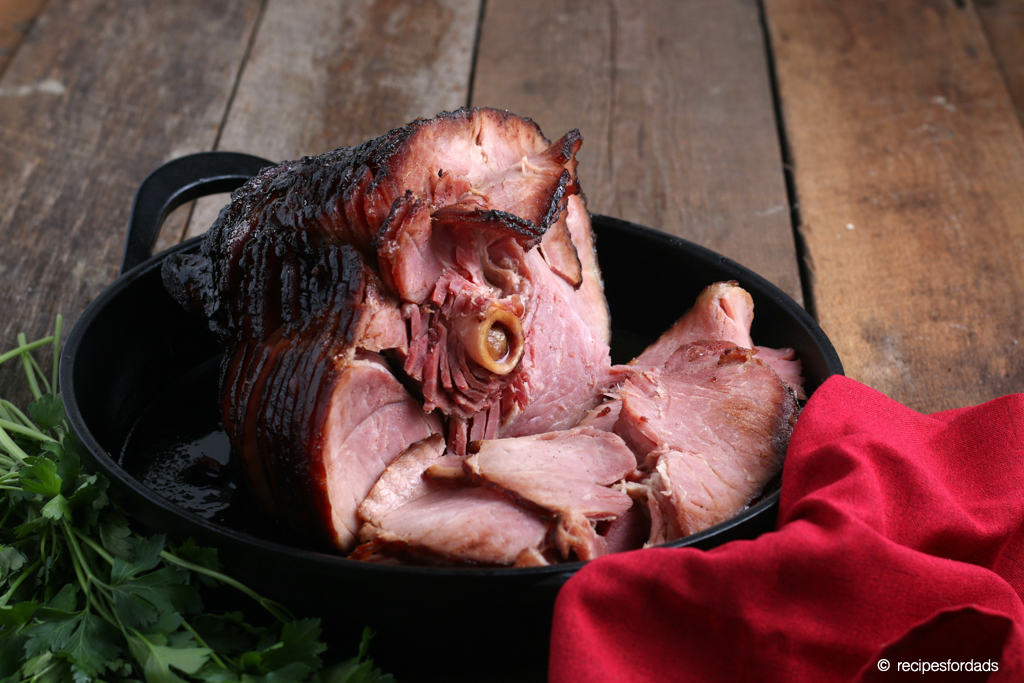 Smoked ham served in a skillet with red napkin