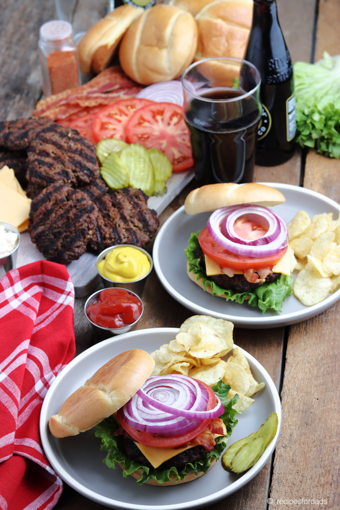 Best Burger Recipe is served up with tomatoes, pickles, lettuce and buns