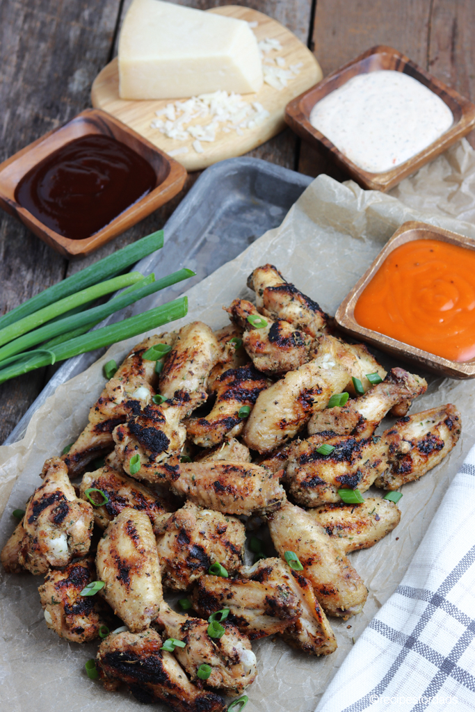 grilled chicken wings served with hot sauce and BBQ Sauce