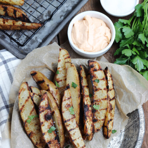 grilled potato wedges served with dipping sauce
