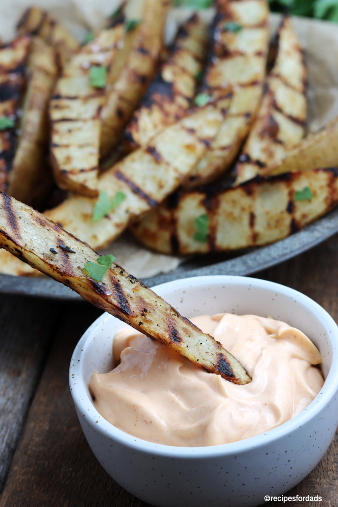 grilled potato wedges served with a mayonnaise sauce