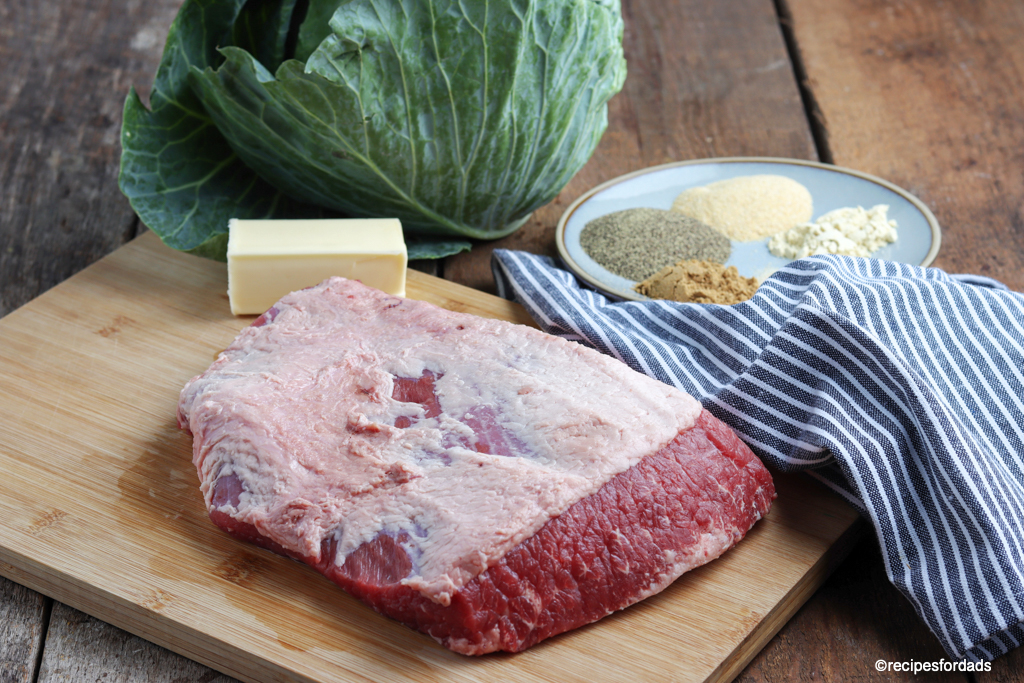 corned beef and cabbage (pre-cooked) displayed with seasonings and blue napkin
