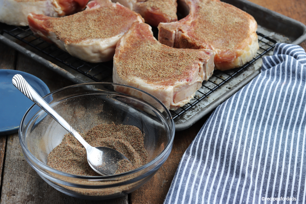 Pork chops coated on both sides with seasoning