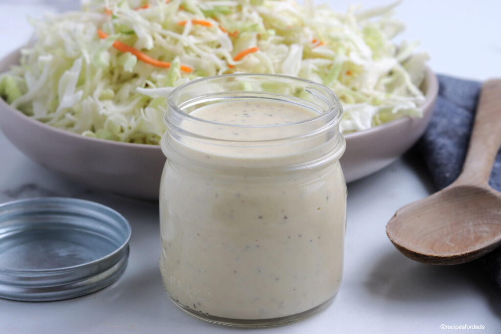 homemade coleslaw dressing recipe served in a mini mason jar