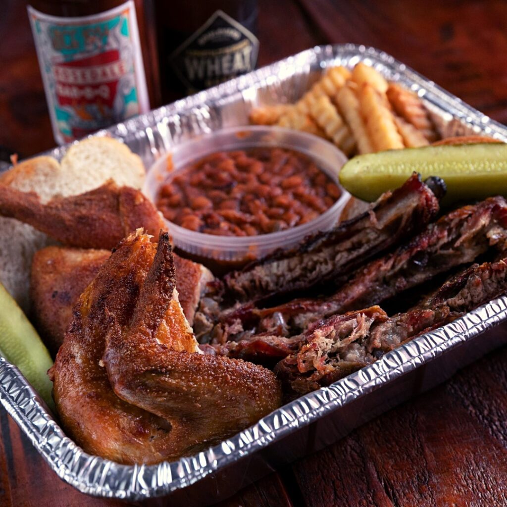 Delicious BBQ, Chicken, baked beans and pickled served at Rosedale's Barbecue restaurant in Kansas City