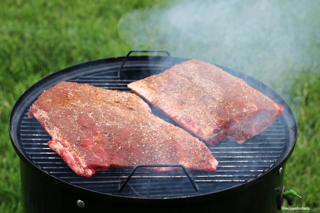 beef ribs cooking on weber smoker