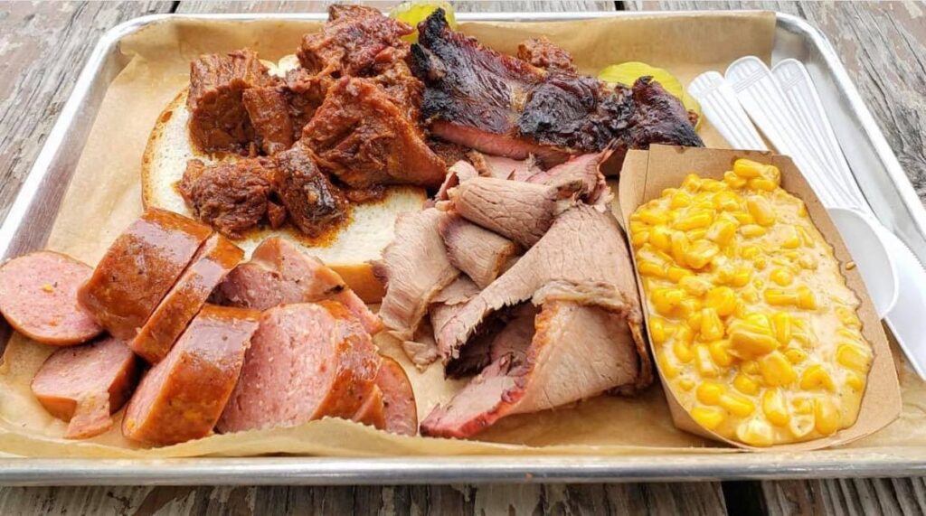BBQ plate with mac and cheese, sausage, brisket and ribs served at Woodyard Bar-Que