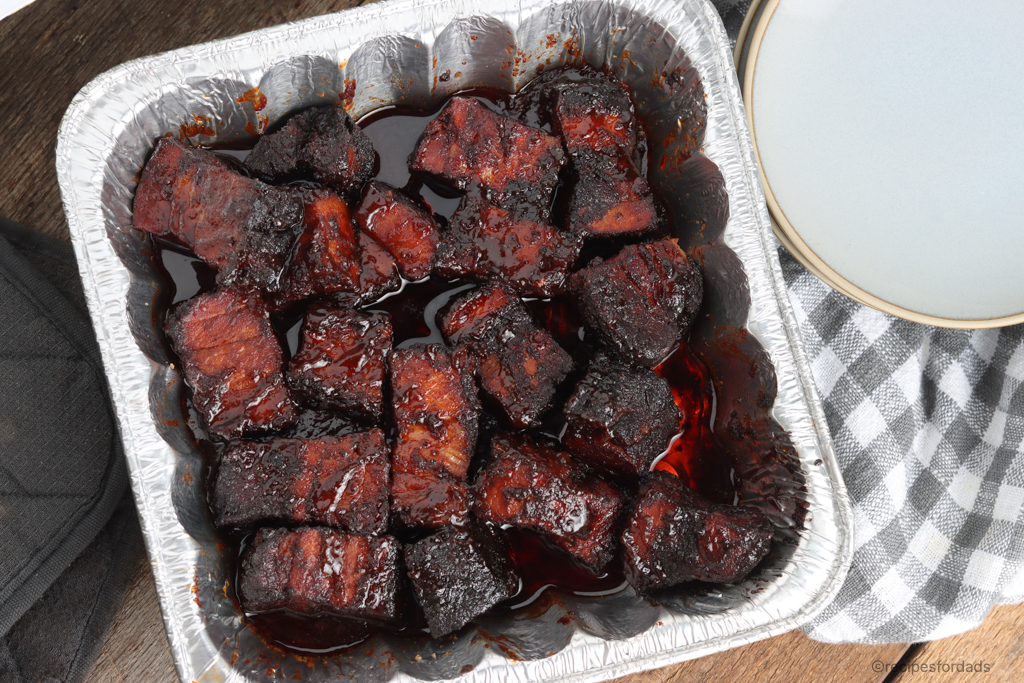 Pork Belly Burnt Ends served in aluminum pan