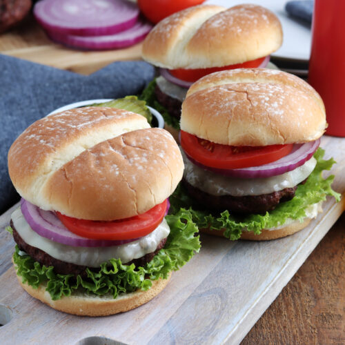 smoked burgers served with condiments