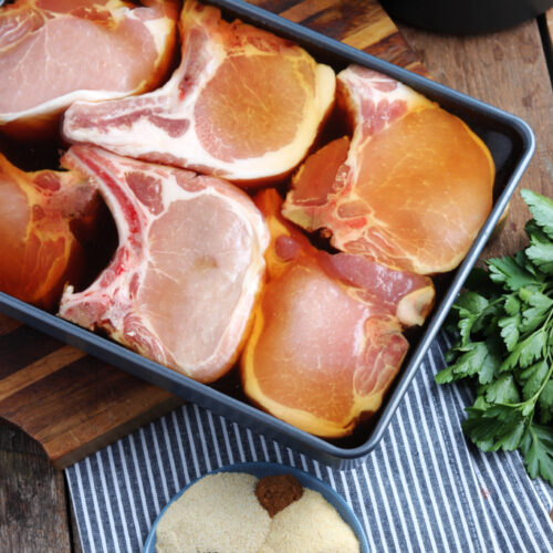 pork chop marinating in pan