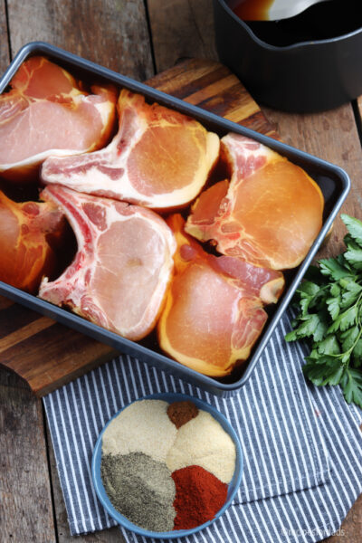 pork chop marinating in pan