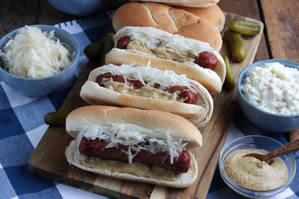 Smoked Brats served with spicy mustard and toppings