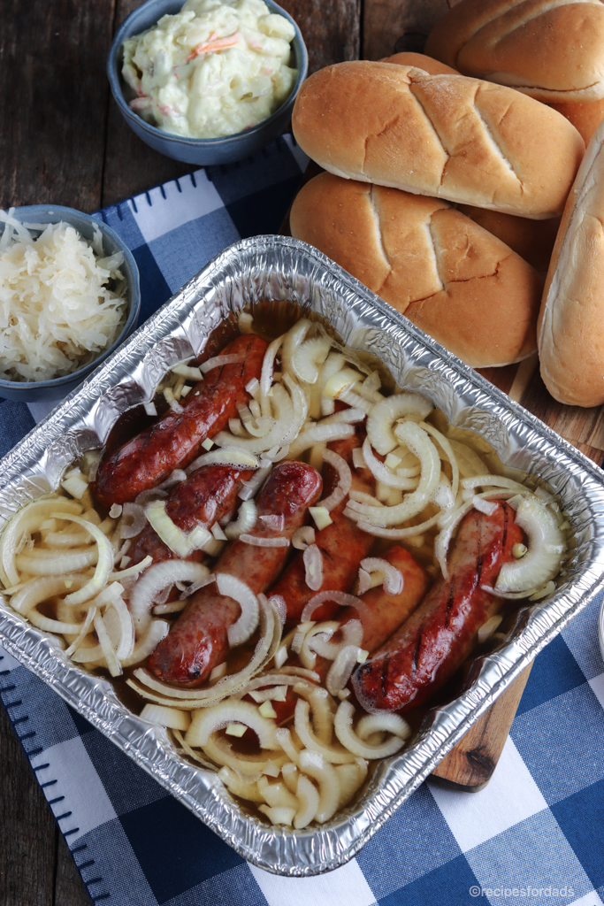 Beer Brat Bath, bratwurst with onion and beer mix in a pan