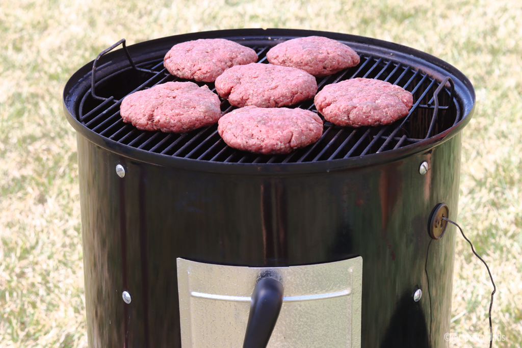 cooking hamburgers on a weber smoker