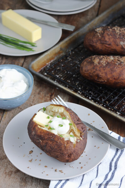 smoked baked potatoes served with sour cream and chives