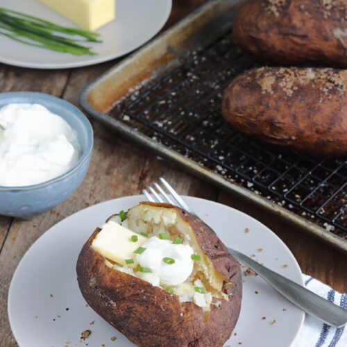 smoked baked potatoes served with sour cream and chives