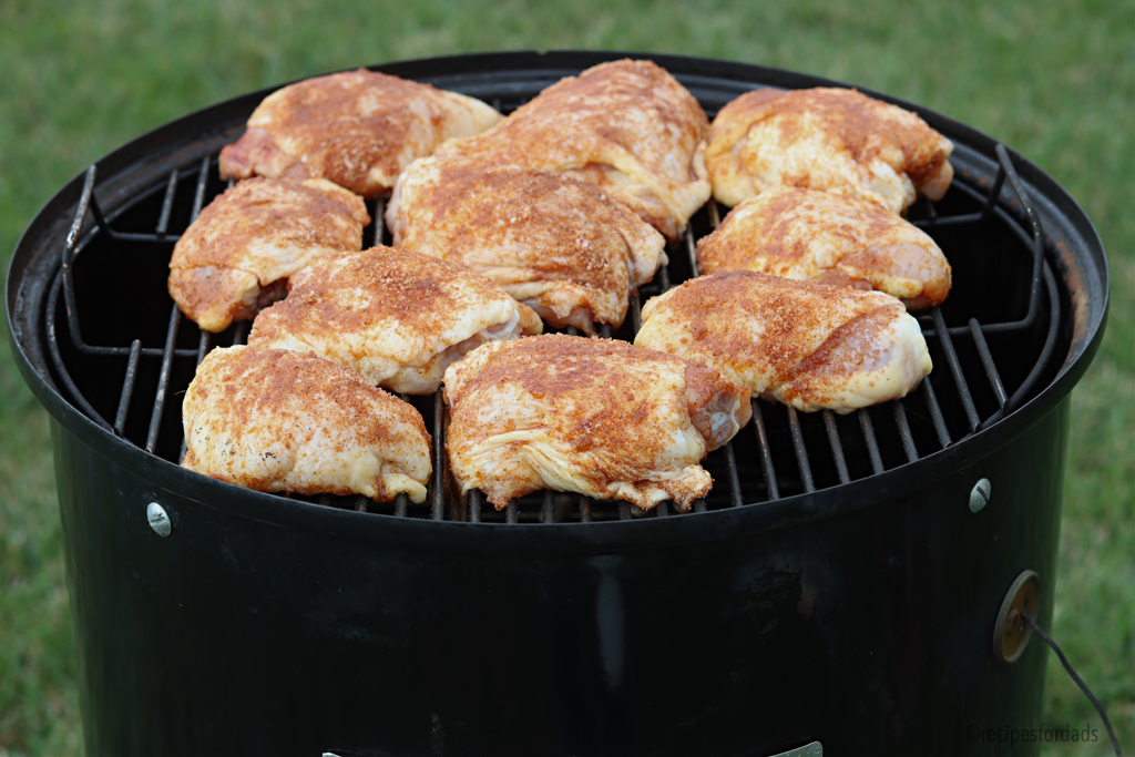 raw chicken thighs on Weber smoker