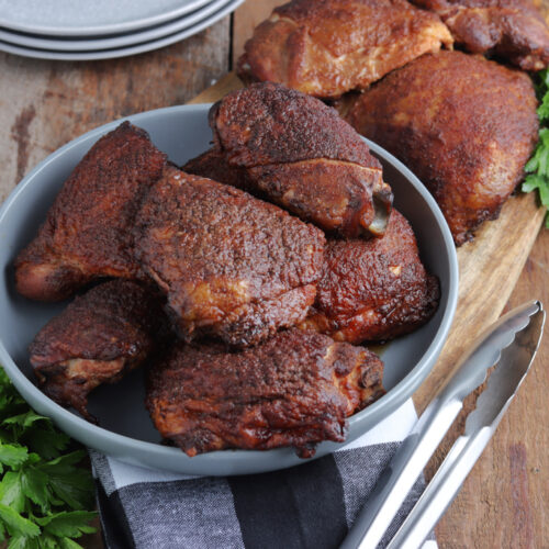 smoked chicken thighs served in gray bowl