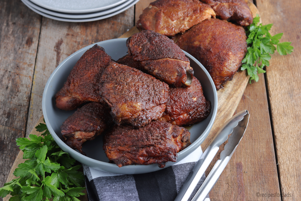 smoked chicken thighs served in gray bowl