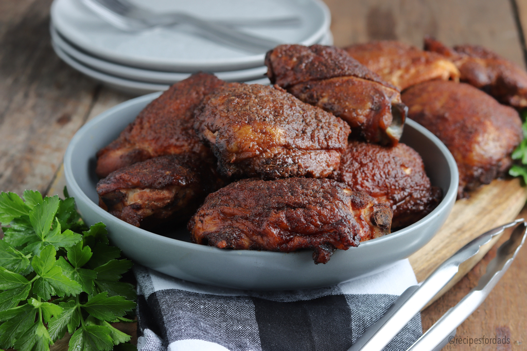 smoked chicken thighs served in gray bowl