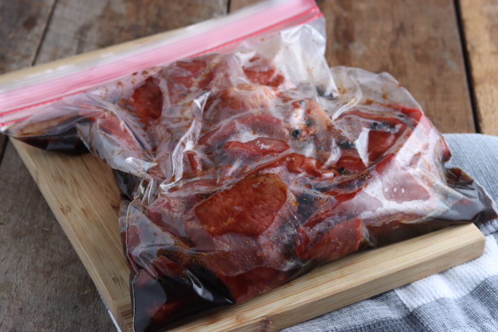 beef marinating in ziplock bag