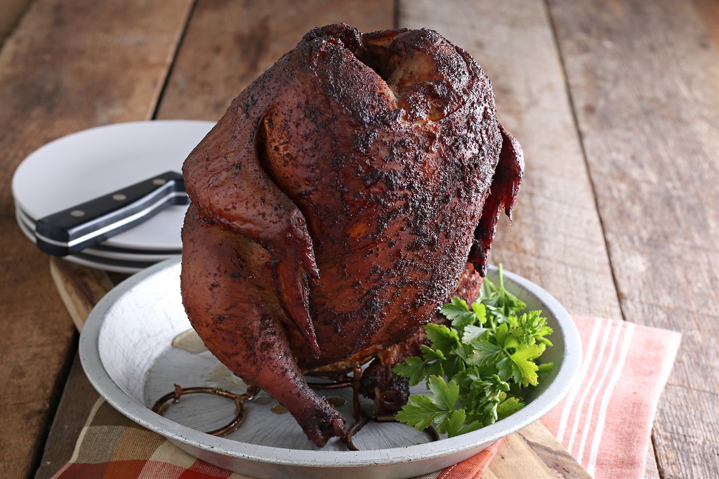 beer can chicken (smoked) sitting on serving plate