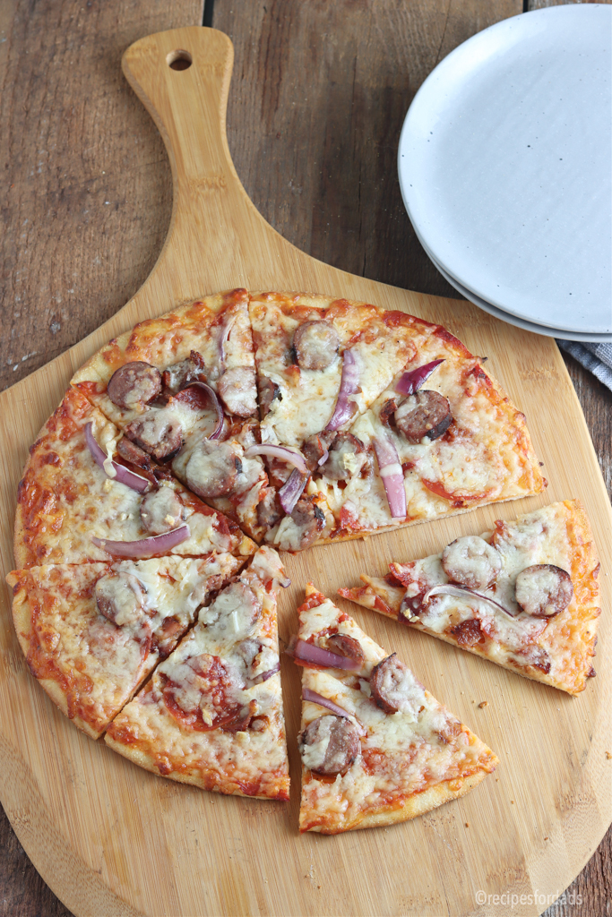 smoked pizza on a pizza serving dish