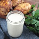 alabama white sauce served with chicken thighs