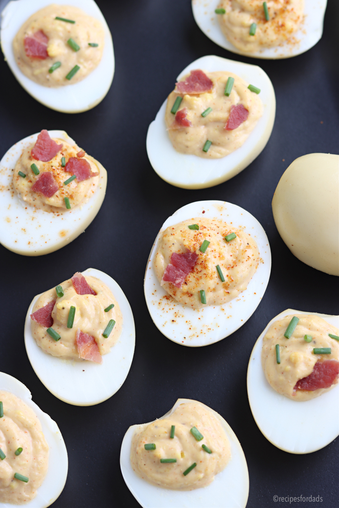 smoked eggs served on black plate