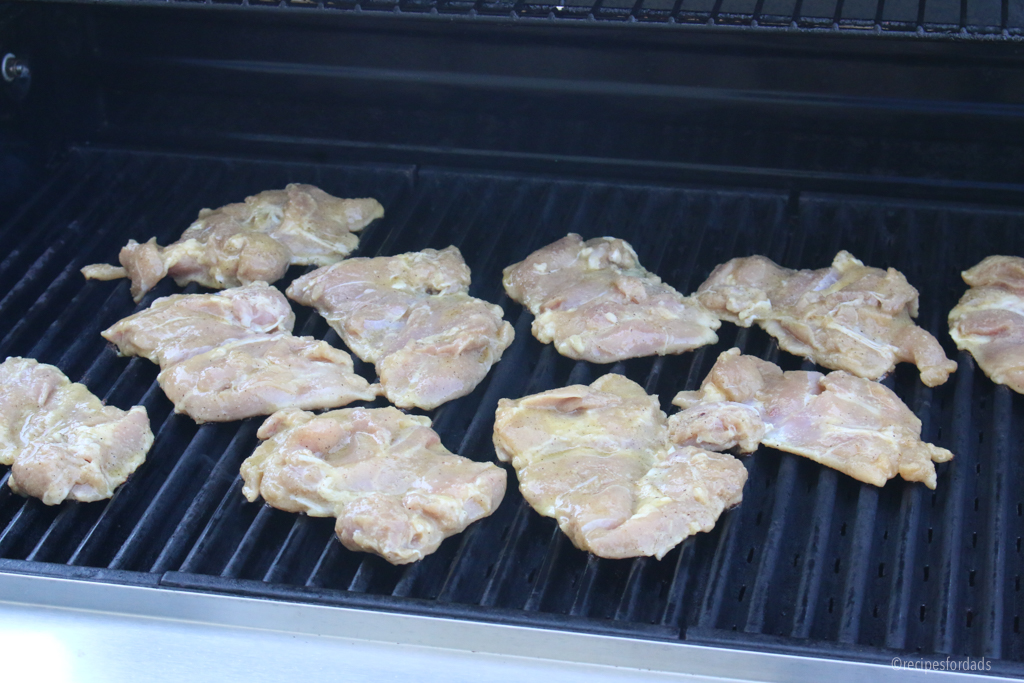 Chicken thighs on grill.