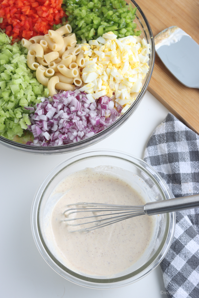 Mixing Macaroni Salad dressing ingredients in glass bowl