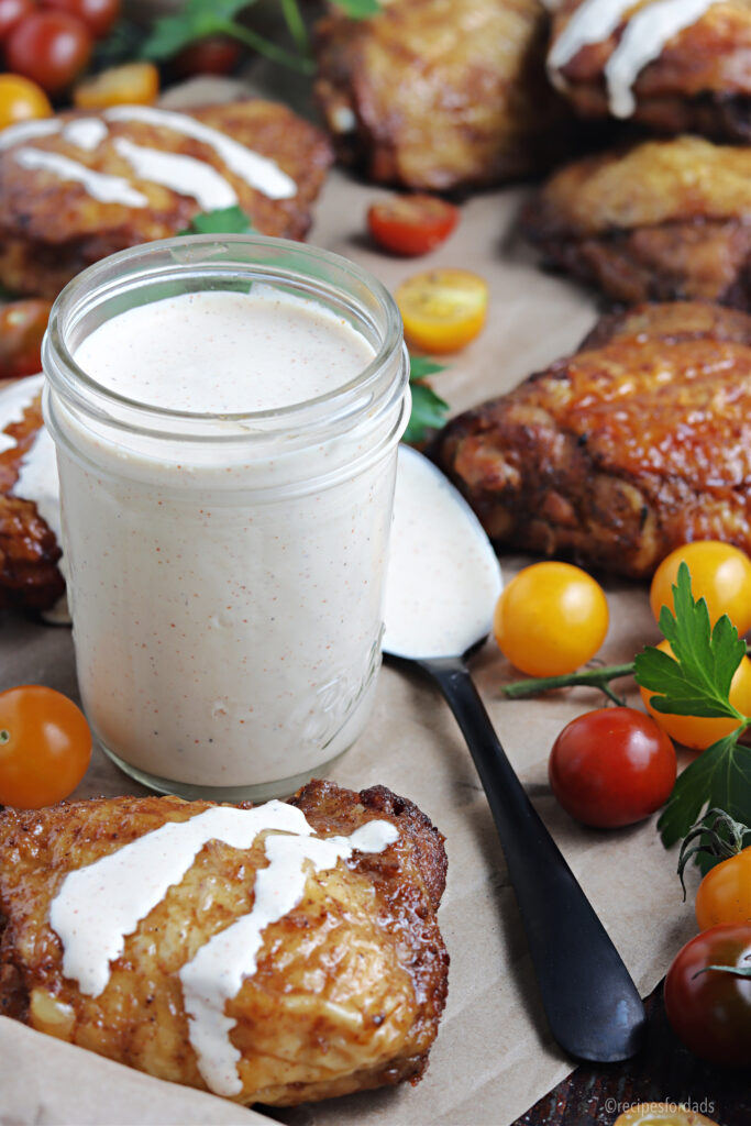 Alabama white sauce poured over chicken thighs