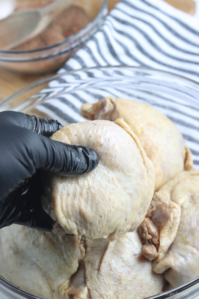 Removing chicken fresh from brine.
