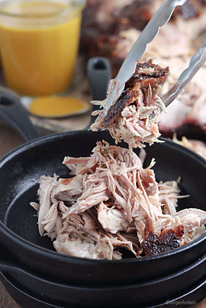 Traeger Pulled pork barbecue served in iron skillet 