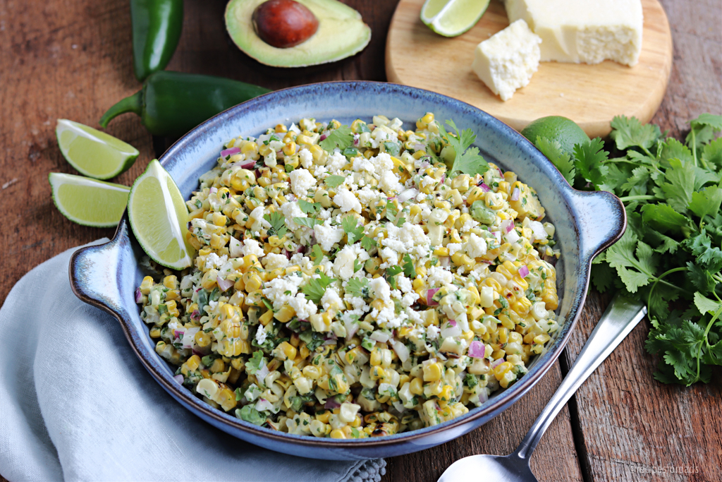 mexican street corn served with limes