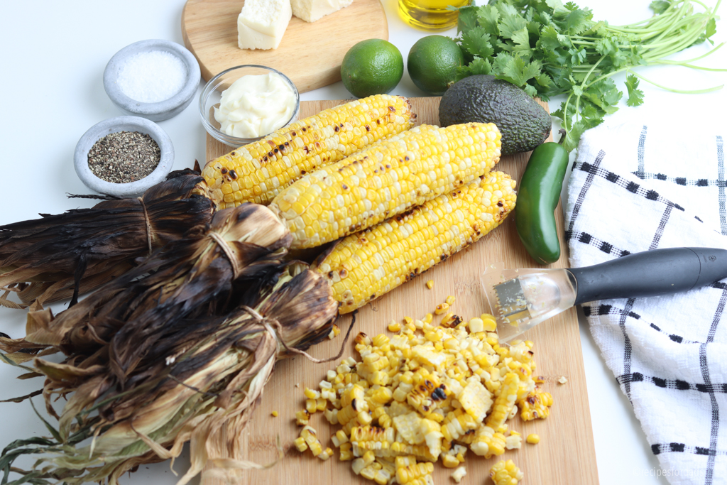 charred grilled corn on the cob with husks