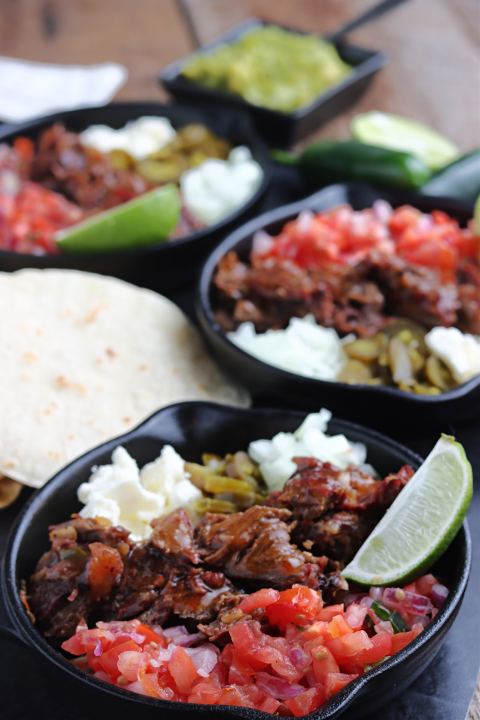 smoked barbacoa served with salsa, cheese and lime